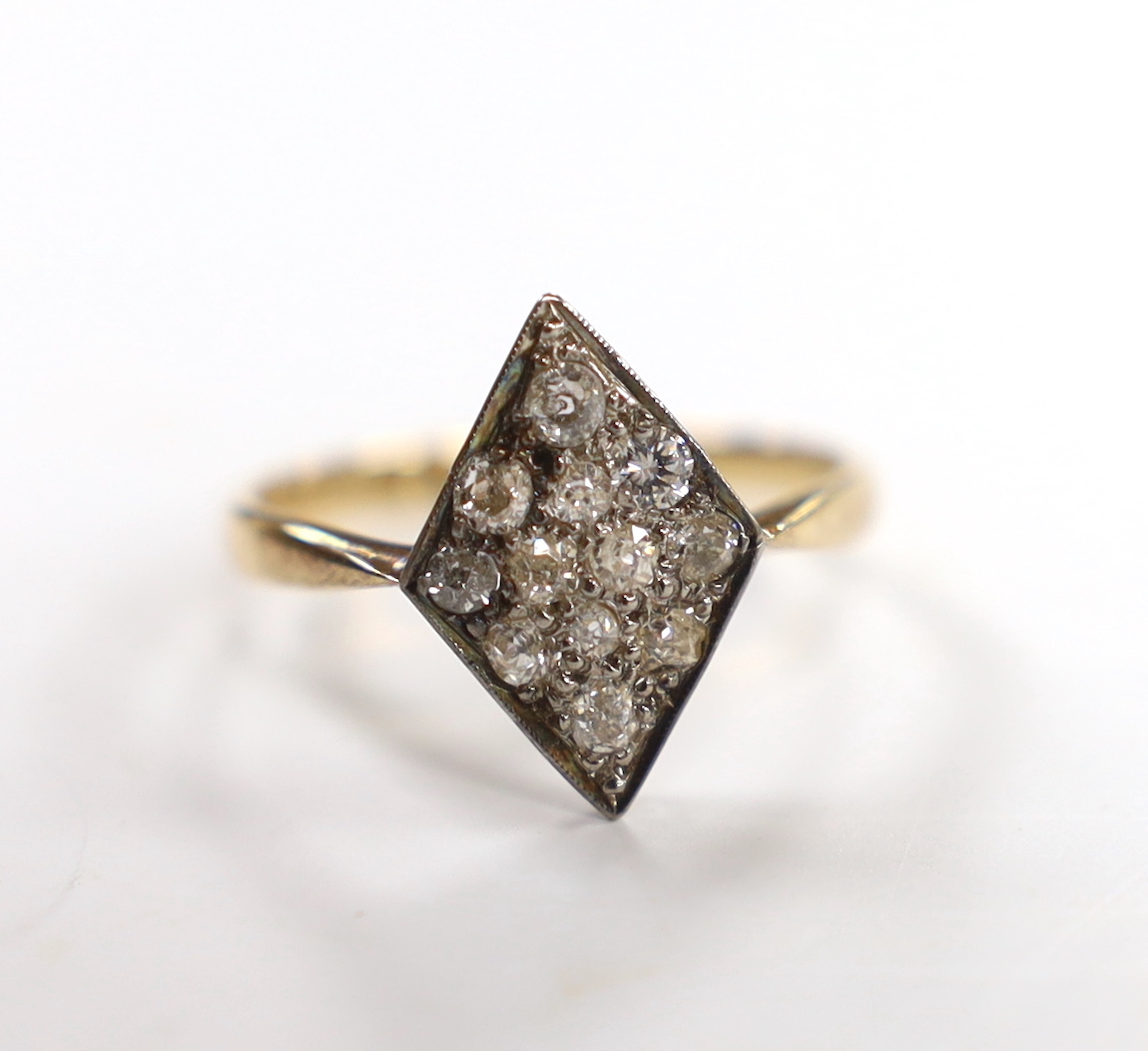 A late Victorian 18ct and diamond set diamond shaped cluster ring, size P, gross weight 2.7 grams.